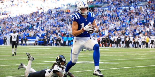 Alec Pierce #14 of the Indianapolis Colts scores a touchdown against the Jacksonville Jaguars during the fourth quarter at Lucas Oil Stadium on October 16, 2022 in Indianapolis, Indiana.