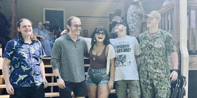 The Monroe triplets, Peter, Thomas and Lauren, and the Martin twins, Christopher and Matthew, pose for a picture at a family reunion.