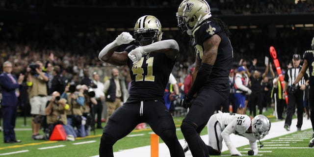 Alvin Kamara (41) of the New Orleans Saints celebrates a touchdown in the third quarter against the Las Vegas Raiders on October 30, 2022 in New Orleans.