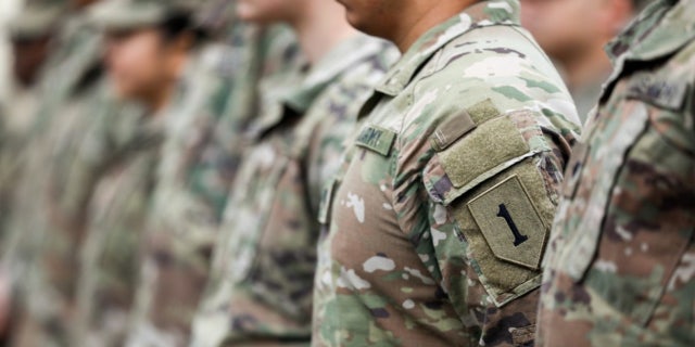 Army national guard soldiers stand at attention