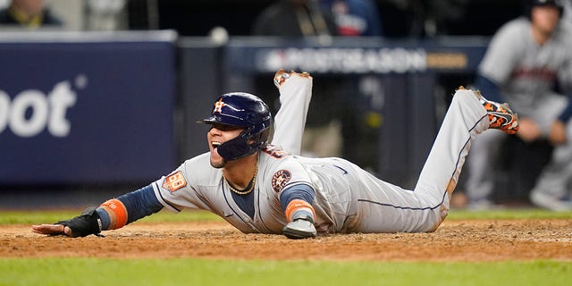 Houston Astros' Yuri Gurriel returns home after scoring against the New York Yankees in Game 6 of Game 3 of the American League Championship Baseball Series in New York, Saturday, October 22, 2022. react when 