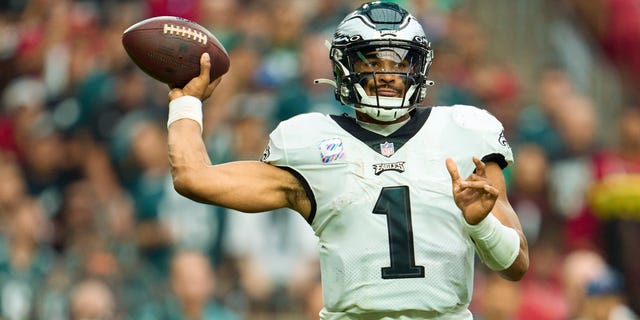 Jalen Hurts of the Philadelphia Eagles drops back to pass against the Arizona Cardinals at State Farm Stadium Oct. 9, 2022, in Glendale, Ariz. 