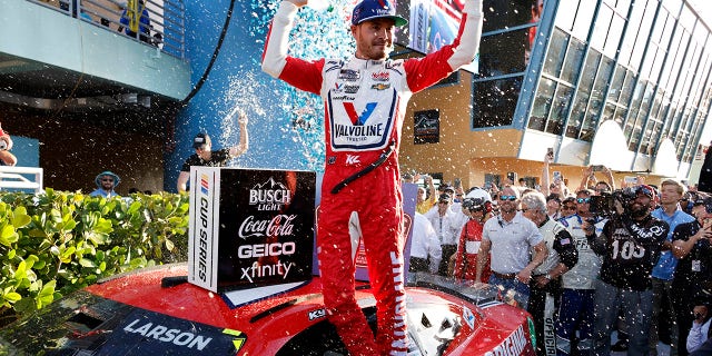 Kyle Larson celebrates after winning a NASCAR Cup Series auto race at Homestead-Miami Speedway, Sunday, Oct. 23, 2022, in Homestead, Florida.