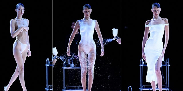 Bella Hadid struts runway topless, then will get white gown spray-painted for Paris Trend Week