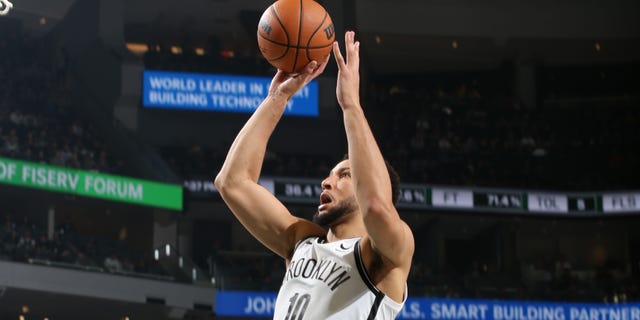 #10 Ben Simmons of the Brooklyn Nets drives into the basket during a game against the Milwaukee Bucks on October 26, 2022 at the Fiserv Forum Center in Milwaukee, Wisconsin.