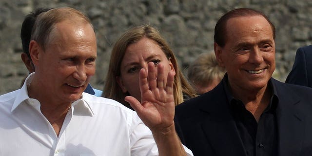 Russian President Vladimir Putin and former Italian Prime Minister Silvio Berlusconi are seen during joint visit to Chersonesus museum in Sevastopol, Crimea, Sept. 12, 2015.