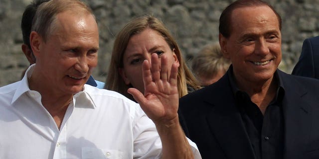 Russian President Vladimir Putin and former Italian Prime Minister Silvio Berlusconi are seen during joint visit to Chersonesus museum in Sevastopol, Crimea, Sept. 12, 2015.
