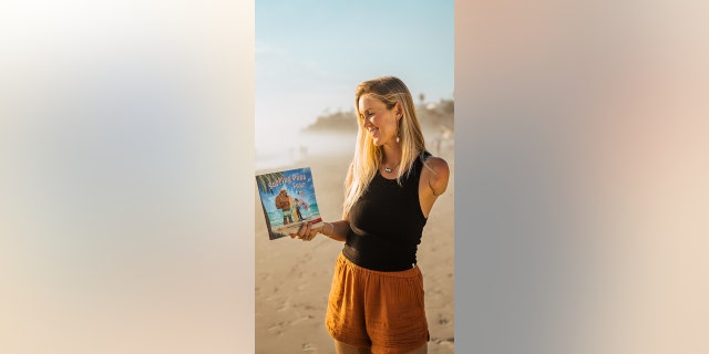 Bethany Hamilton holds a copy of "Surfing Past Fear." She would much rather help others "get back out there" rather than dwell on things that can go wrong or worry about the "worst-case ‘what ifs,’" she told Fox News Digital.
