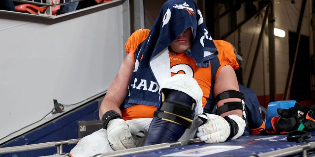 Garett Bolles of the Denver Broncos is carted off the field during a game against the Indianapolis Colts at Empower Field At Mile High Oct. 6, 2022, in Denver, Colo.