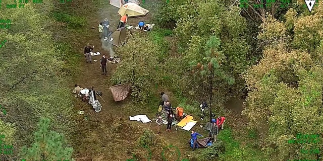 The members of the Boy Scout troop were reunited with their families at the forest's visitor's center.