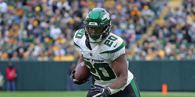 Breece Hall of the New York Jets runs during a game against the Green Bay Packers at Lambeau Field Oct. 16, 2022, in Green Bay, Wis.