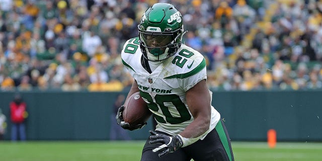 Breece Hall of the New York Jets runs during a game against the Green Bay Packers at Lambeau Field Oct. 16, 2022, in Green Bay, Wis.