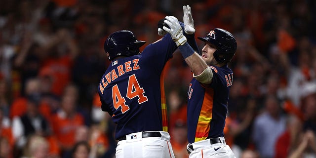 Alex Bregman #2 of the Houston Astros hits a three-run homer against the New York Yankees against Jordan Alvarez #44 in the third inning of Game 2 of the American League Championship Series at Minute Maid Park in Houston on October 20, 2022. celebrate the  ,Texas.