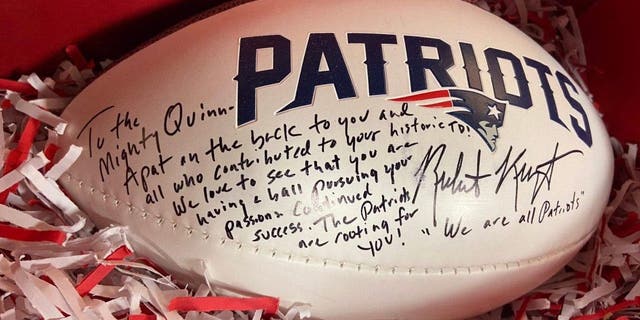 The autographed football the New England Patriots and owner Robert Kraft sent to Brockton HS football player McKenzie Quinn after scoring the first touchdown in school history as a female.