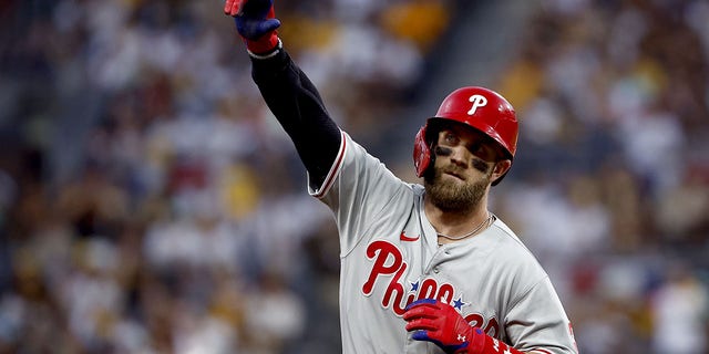 Bryce Harper #3 of the Philadelphia Phillies reacts after hitting a home run during the fourth inning against the San Diego Padres in game one of the National League Championship Series at PETCO Park on October 18, 2022 in San Diego, California.
