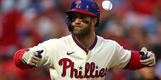 Bryce Harper #3 of the Philadelphia Phillies reacts after hitting a two-run home run during the eighth inning against the San Diego Padres in game five of the National League Championship Series at Citizens Bank Park on October 23, 2022 in Philadelphia, Pennsylvania.