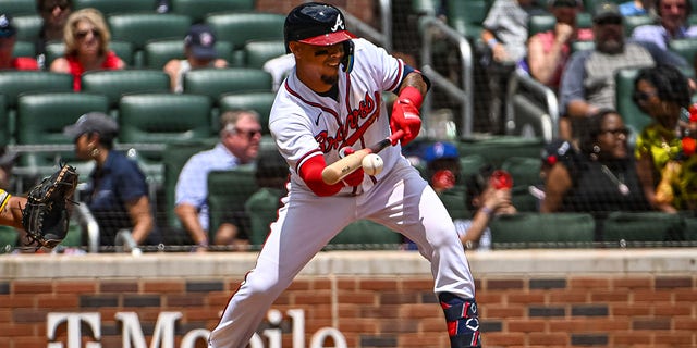 Atlanta Braves catcher William Contreras (24) tries to bunt in the tenth inning during a game against the San Diego Padres May 15, 2022, at Truist Park in Atlanta, Ga.