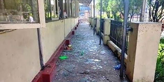 In this photo provided by the Military True News Information Team, a parcel-reception location at the entrance of the Insein prison sits damaged after an explosion Wednesday, Oct. 19, 2022, in Yangon, Myanmar. A bombing on Wednesday near the front gate of Myanmar’s main prison for political detainees killed a number people, including visitors and prison personnel, local media and the government said.