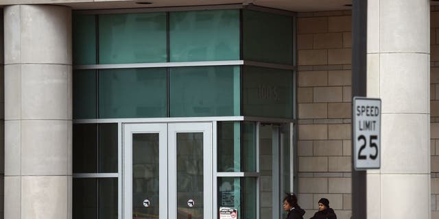 Two women enter the Buzz Westfall Justice Center in Clayton, Missouri.