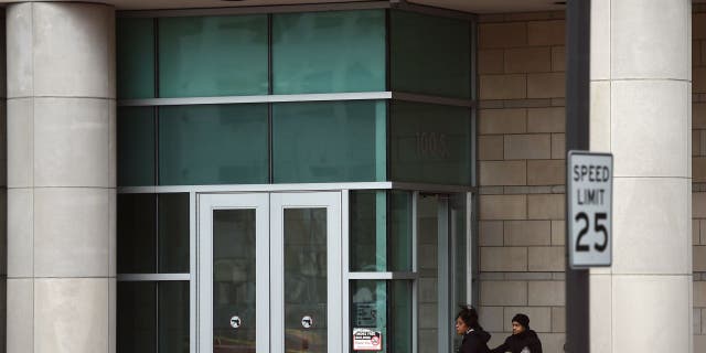 Two women enter the Buzz Westfall Justice Center in Clayton, Missouri.