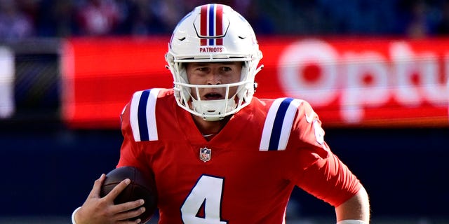 Bailey Zappe of the New England Patriots scrambles against the Detroit Lions at Gillette Stadium on Oct. 9, 2022, in Foxborough, Massachusetts.