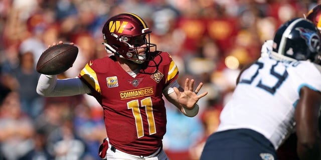 Carson Wentz #11 of the Washington Commanders throws the ball during the third quarter against the Tennessee Titans at FedExField on October 09, 2022 in Landover, Maryland.