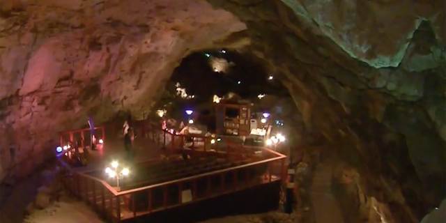 The group is stuck 200 feet below ground in Grand Canyon Caverns. 