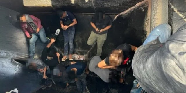 Thirteen illegal immigrants hidden inside a grain hopper rail car.