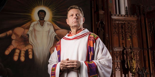 Roman Catholic Father Michael Pfleger poses in Saint Sabina Catholic Church in in Chicago January 9, 2009. 