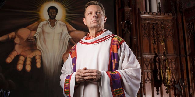 Roman Catholic Father Michael Pfleger poses in Saint Sabina Catholic Church in in Chicago January 9, 2009. 