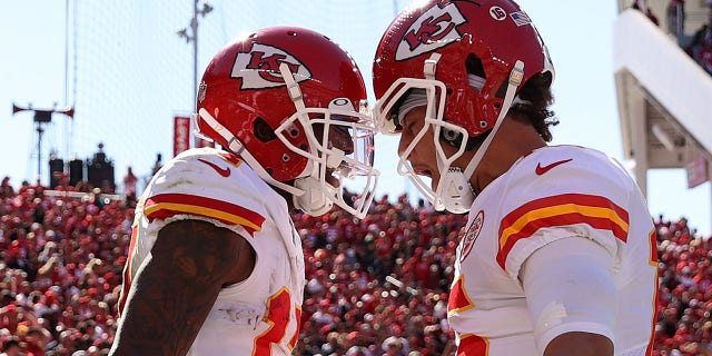 Mecole Hardman celebrates with Patrick Mahomes of the Chiefs after catching a touchdown pass against the 49ers on Oct. 23, 2022.