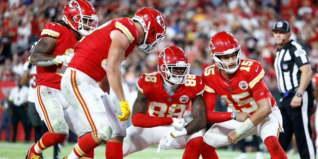 Patrick Mahomes #15 and Jody Fortson #88 of the Kansas City Chiefs celebrate a touchdown against the Tampa Bay Buccaneers during the third quarter at Raymond James Stadium on October 02, 2022 in Tampa, Florida.
