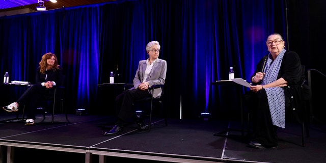 Republican nominee Christine Drazan, left, and Democratic nominee Tina Kotek, middle, listen to unaffiliated candidate Betsy Johnson speak during the gubernatorial debate hosted by Oregon Newspaper Publishers Association at Mount Hood Oregon Resort in Welches, Ore., Friday, July 29, 2022. 