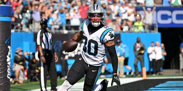 Chuba Hubbard #30 of the Carolina Panthers celebrates after scoring a touchdown in the third quarter against the Tampa Bay Buccaneers at Bank of America Stadium on October 23, 2022, in Charlotte, North Carolina.