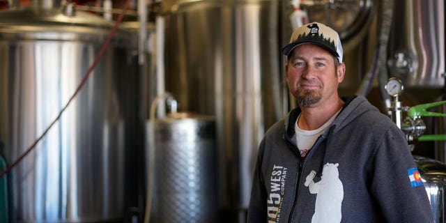 Colorado brewery owner Eric Seufert poses at his business in Castle Rock, Colo. Breweries, among other establishments, may begin using treated wastewater should Colorado officials approve the practice.