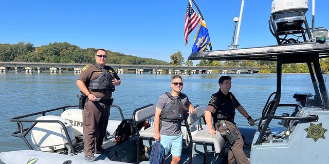 Police officers pull up on a boat during Operation Deep Blue's The Expedition to Honor Our Fallen event.