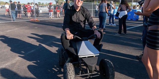 A guest attending the Cyber Rodeo at Tesla's Austin factory in April brought his Cyberquad for Kids.