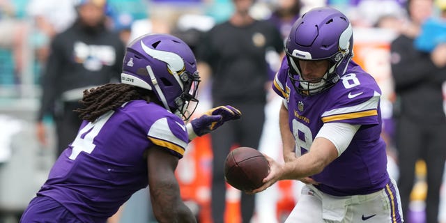 Kirk Cousins #8 of the Minnesota Vikings hands off to Dalvin Cook #4 of the Minnesota Vikings during the second half against the Miami Dolphins at Hard Rock Stadium on October 16, 2022 in Miami Gardens, Florida.