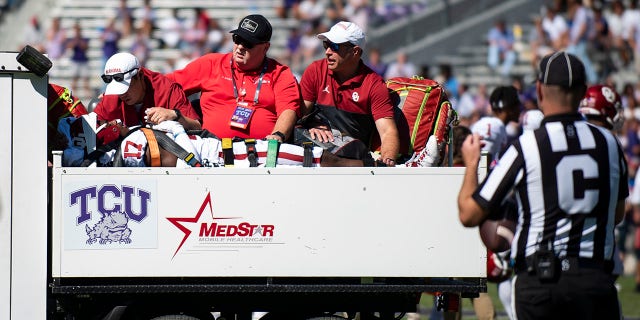 Defensive back Damond Harmon (17) of the Oklahoma Sooners is carted off of the field after sustaining an injury during the second half of Oklahoma's road game against TCU at Amon G. Carter Stadium Oct. 1, 2022, in Fort Worth, Texas.