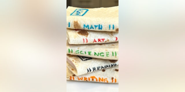 Edible pens can be used to write the names of school subjects on the fronts and sides of the small sandwiches.