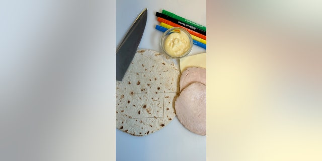 The deli meat should be cut smaller than the tortilla, so the meat fits inside the sandwich.