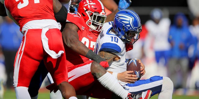 Anthony Johnson (97) of the DC Defenders sacks Jordan Ta'amu (10) of the St. Louis BattleHawks during the XFL game at Audi Field on March 8, 2020 in Washington, DC