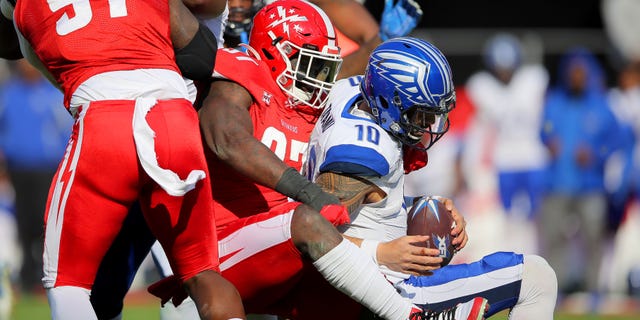 Anthony Johnson (97) of the DC Defenders sacks Jordan Ta'amu (10) of the St. Louis BattleHawks during the XFL game at Audi Field on March 8, 2020, in Washington, D.C.