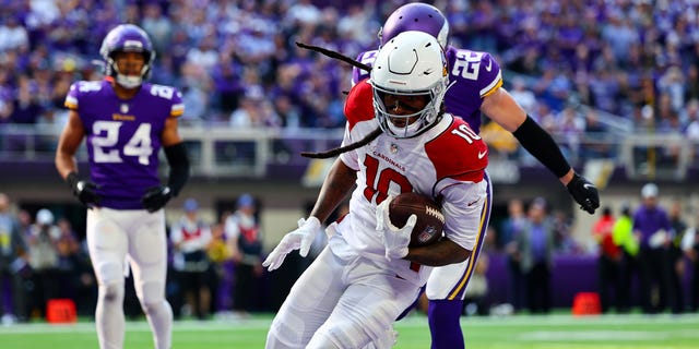 DeAndre Hopkins of the Arizona Cardinals catches the ball for a touchdown against the Minnesota Vikings at U.S. Bank Stadium on Oct. 30, 2022, in Minneapolis.