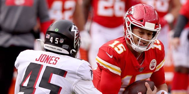 Deion Jones #45 of the Atlanta Falcons tackles Patrick Mahomes #15 of the Kansas City Chiefs during the second quarter at Arrowhead Stadium on December 27, 2020 in Kansas City, Missouri.