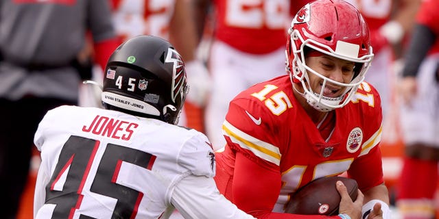 Deion Jones #45 of the Atlanta Falcons tackles Patrick Mahomes #15 of the Kansas City Chiefs during the second quarter at Arrowhead Stadium on December 27, 2020 in Kansas City, Missouri.