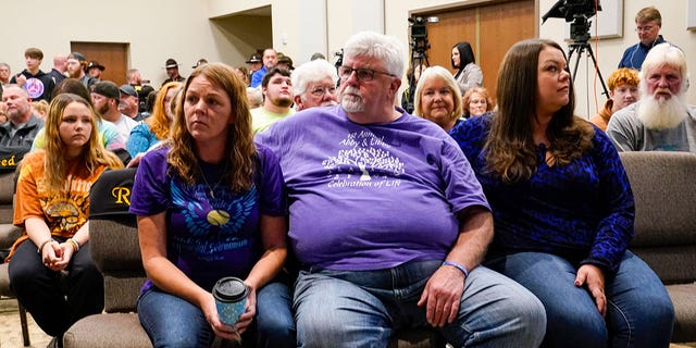 Family members of Liberty German and Abigail Williams listen as Indiana State Police Superintendent Doug Carter announces during a news conference in Delphi, Ind., Monday, Oct. 31, 2022, the arrest of Richard Allen, 50, for the murders of two teenage girls killed during a 2017 hiking trip in northern Indiana. German, 14, and Williams, 13, were killed in February 2017. 