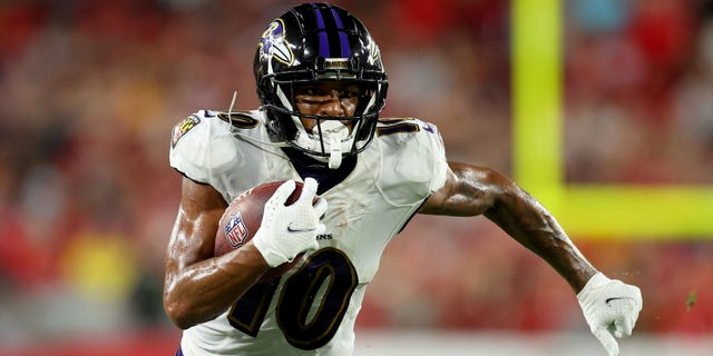 Demarcus Robinson #10 of the Baltimore Ravens carries the ball against the Tampa Bay Buccaneers during the third quarter at Raymond James Stadium on October 27, 2022 in Tampa, Florida.