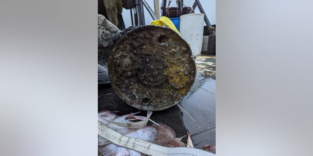 A Navy Explosive Ordnance Disposal (EOD) technician holds an unexploded WWII ordnance, a MK 6, depth charge. Found off the coast of Rhode Island. Navy EOD responded to a request from the U.S. Coast Guard to identify and render safe unexplored ordnance. U.S. Navy EOD can counter explosive threats anytime and in any environment. 