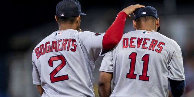 Xander Bogaerts and Rafael Devers of the Boston Red Sox during the third inning of the 2022 Little League Classic game against the Baltimore Orioles Aug. 21, 2022, at Bowman Field in South Williamsport, Pa.